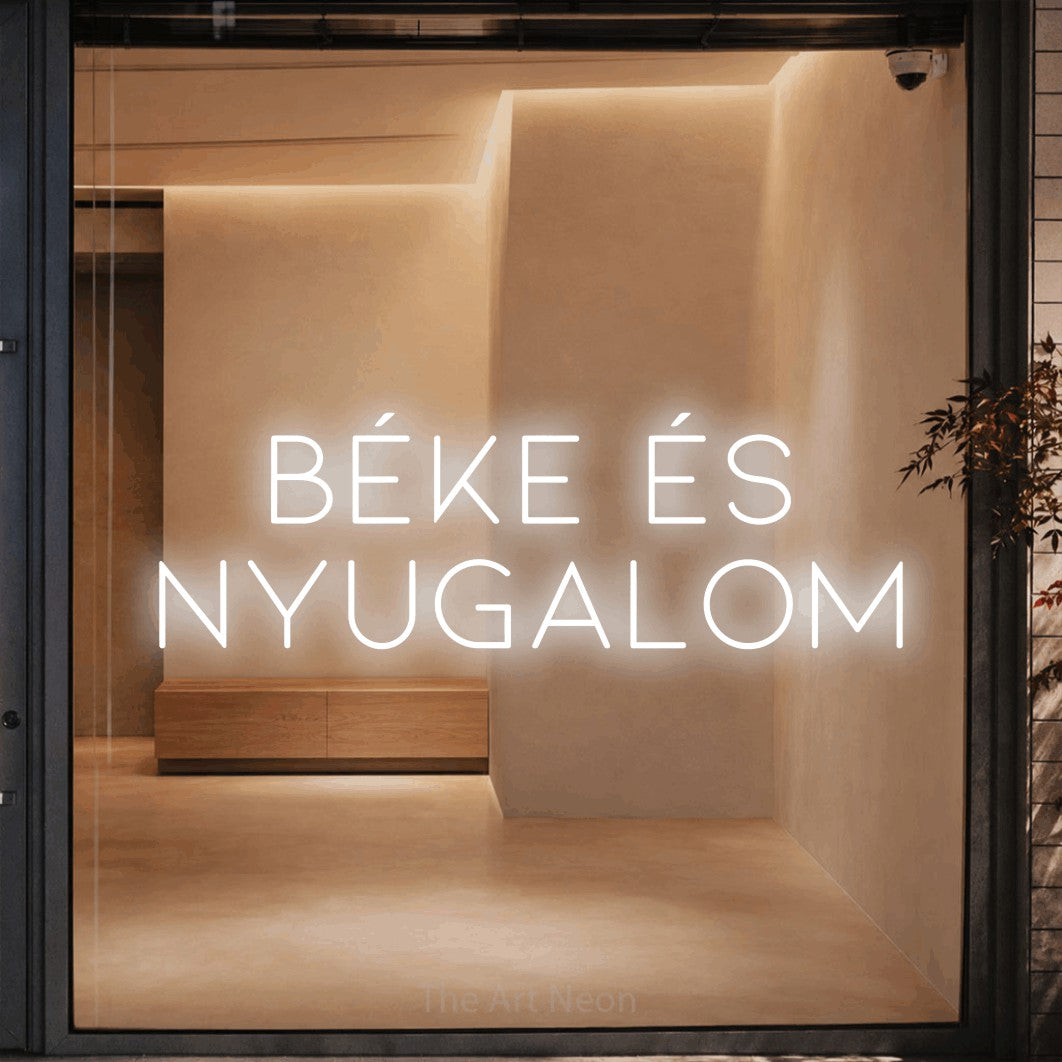 LED neon sign reading “BÉKE ÉS NYUGALOM”, arranged in two lines.