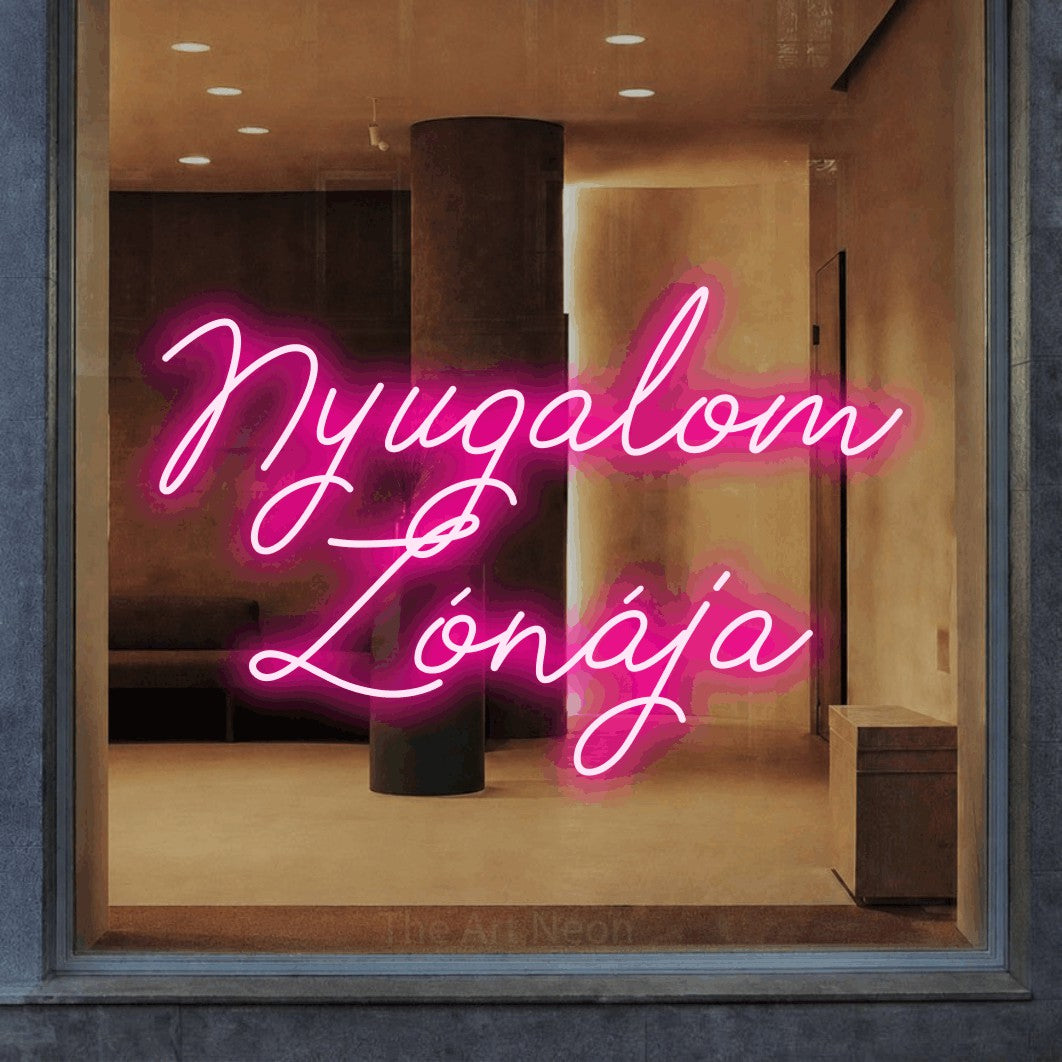 LED neon sign reading “Nyugalom Zónája”, arranged in two lines.