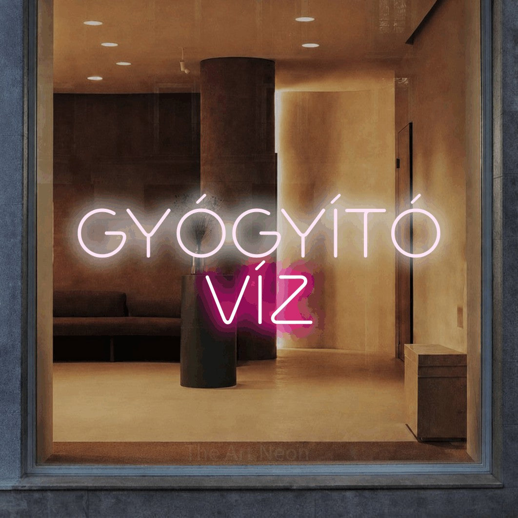 LED neon sign reading “GYÓGYÍTÓ VÍZ”, arranged in two lines.