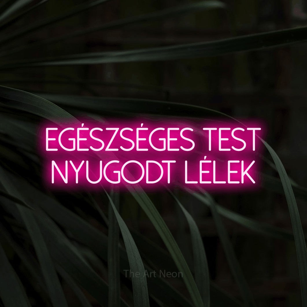 LED neon sign reading “Egészséges Test Nyugodt Lélek”, arranged in two lines.