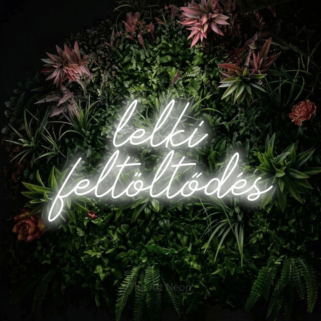 LED neon sign reading “lelki feltöltődés”, arranged in two lines.