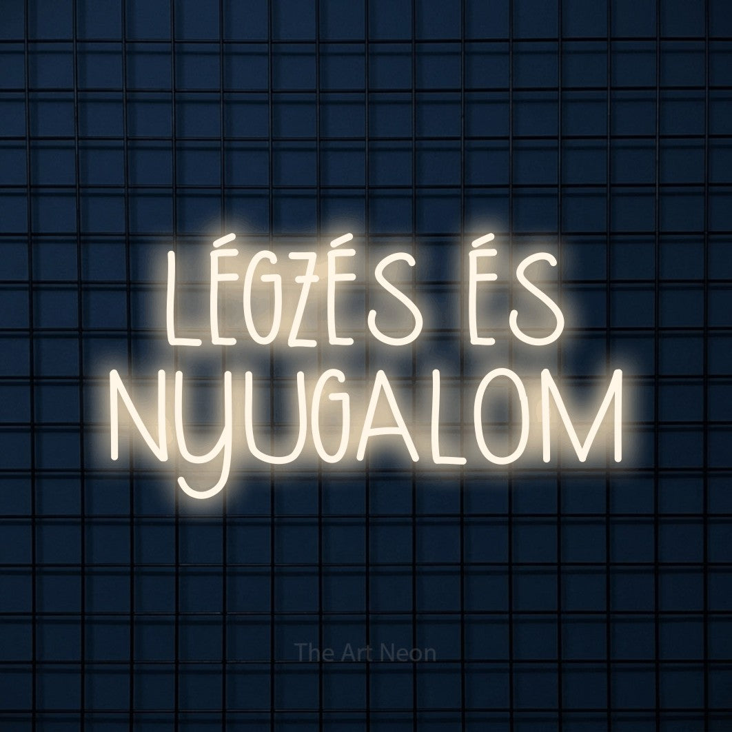 LED neon sign reading “LÉGZÉS ÉS NYUGALOM”, arranged in two lines.