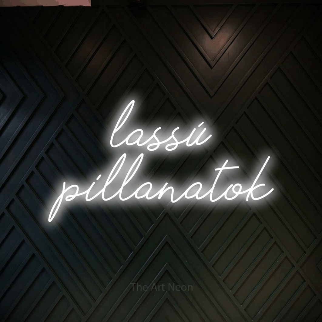 LED neon sign reading “lassú pillanatok”, arranged in two lines.