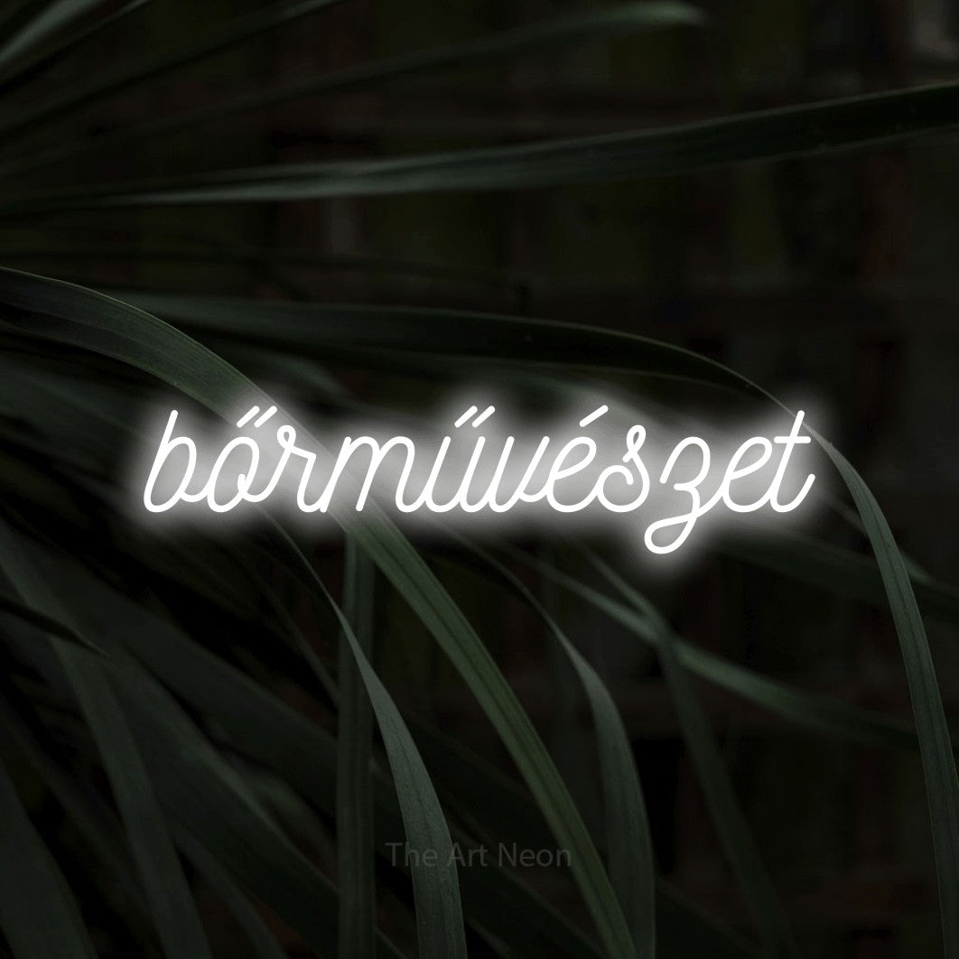 LED neon sign reading “bőrművészet”, arranged in a single line.