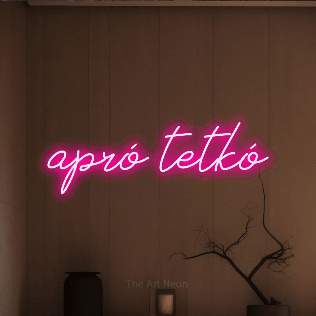 LED neon sign reading “apró tetkó”, arranged in a single line.