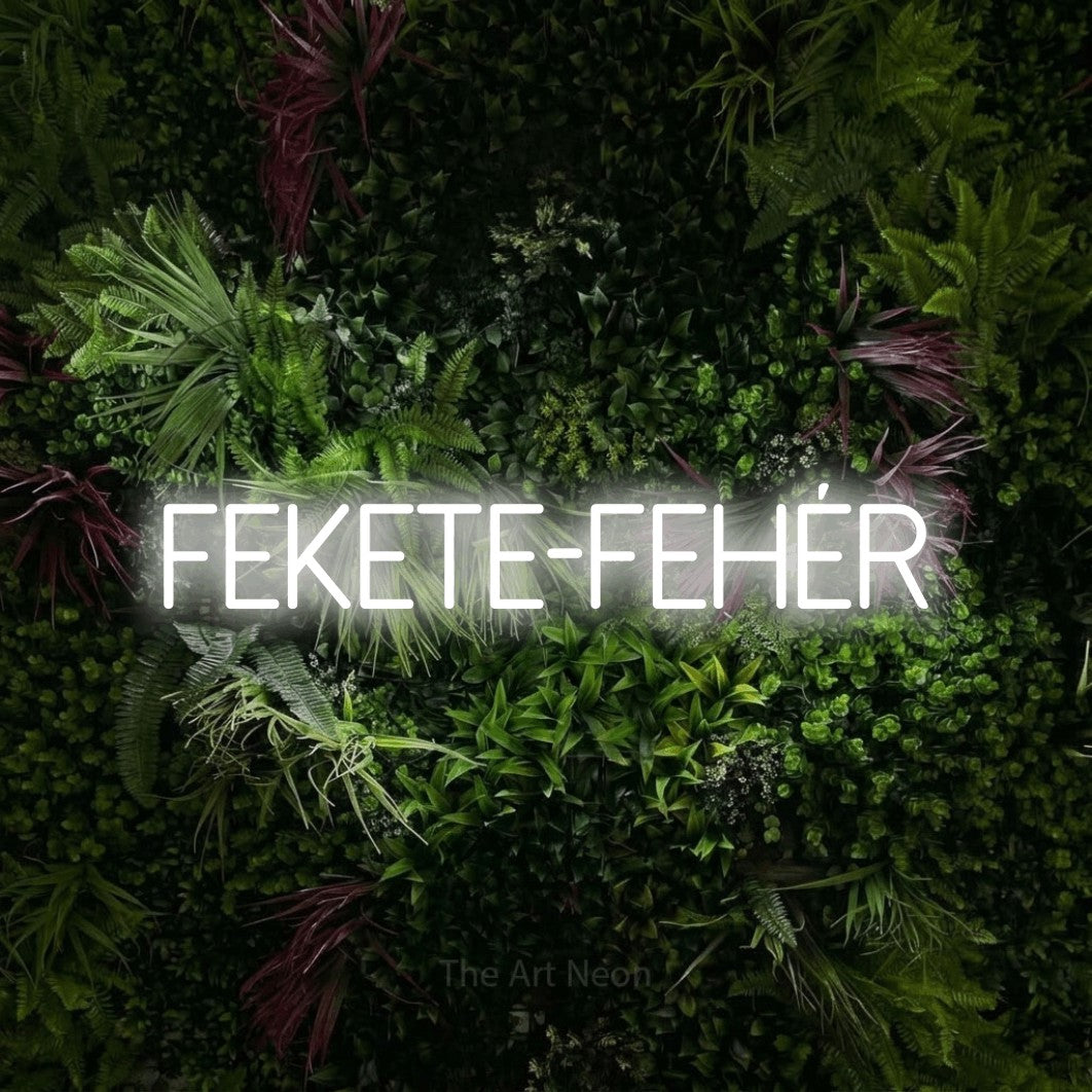 LED neon sign reading “FEKETE-FEHÉR”, arranged in a single line.