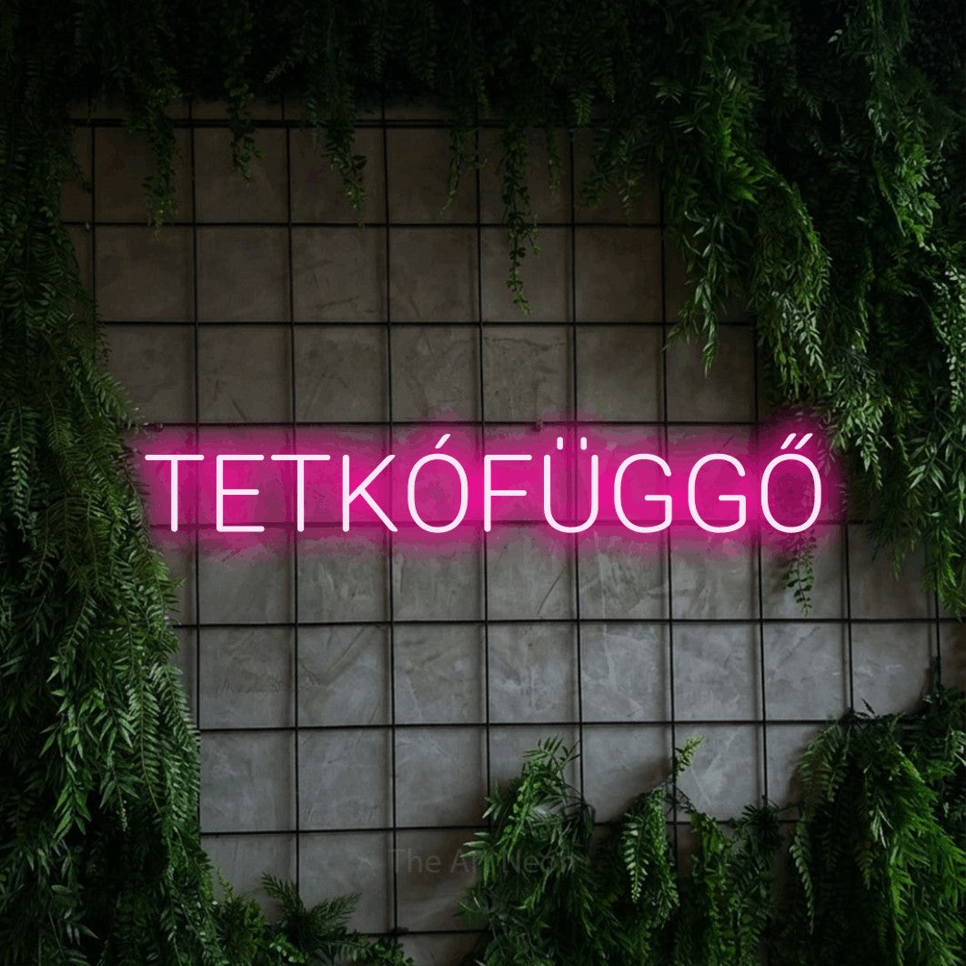 LED neon sign reading “TETKÓFÜGGŐ”, arranged in a single line.