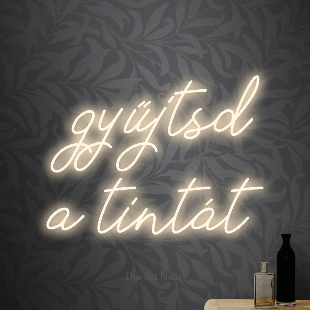 LED neon sign reading “gyűjtsd a tintát”, arranged in two lines.