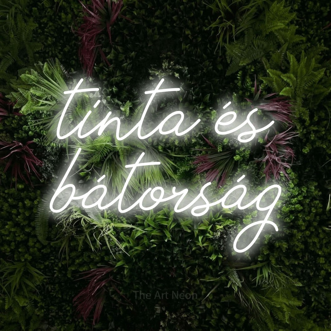 LED neon sign reading “tinta és bátorság”, arranged in two lines.