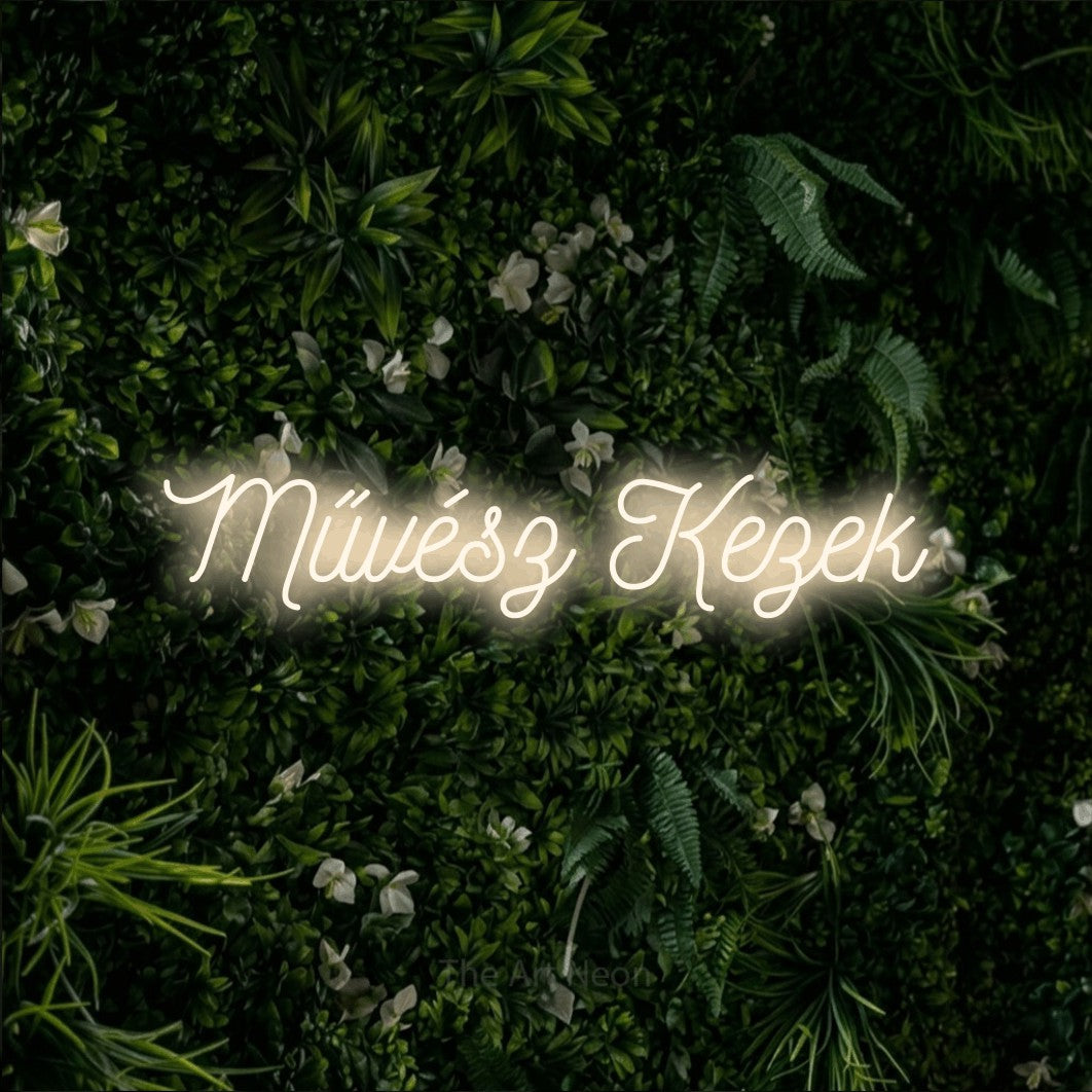LED neon sign reading “Művész Kezek”, arranged in a single line.