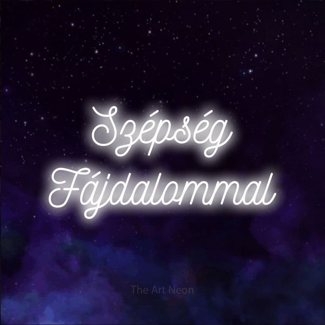 LED neon sign reading “Szépség Fájdalommal”, arranged in two lines.