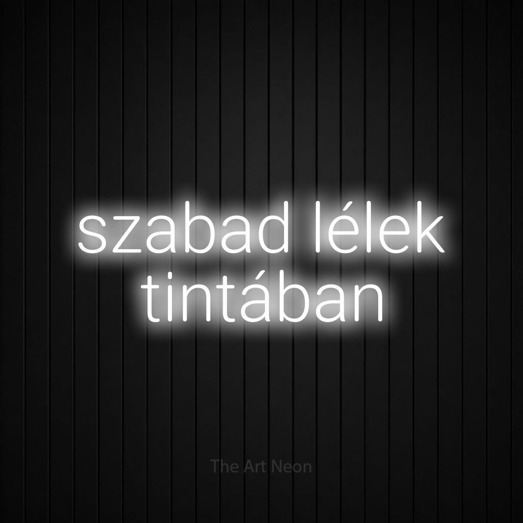 LED neon sign reading “szabad lélek tintában”, arranged in two lines.