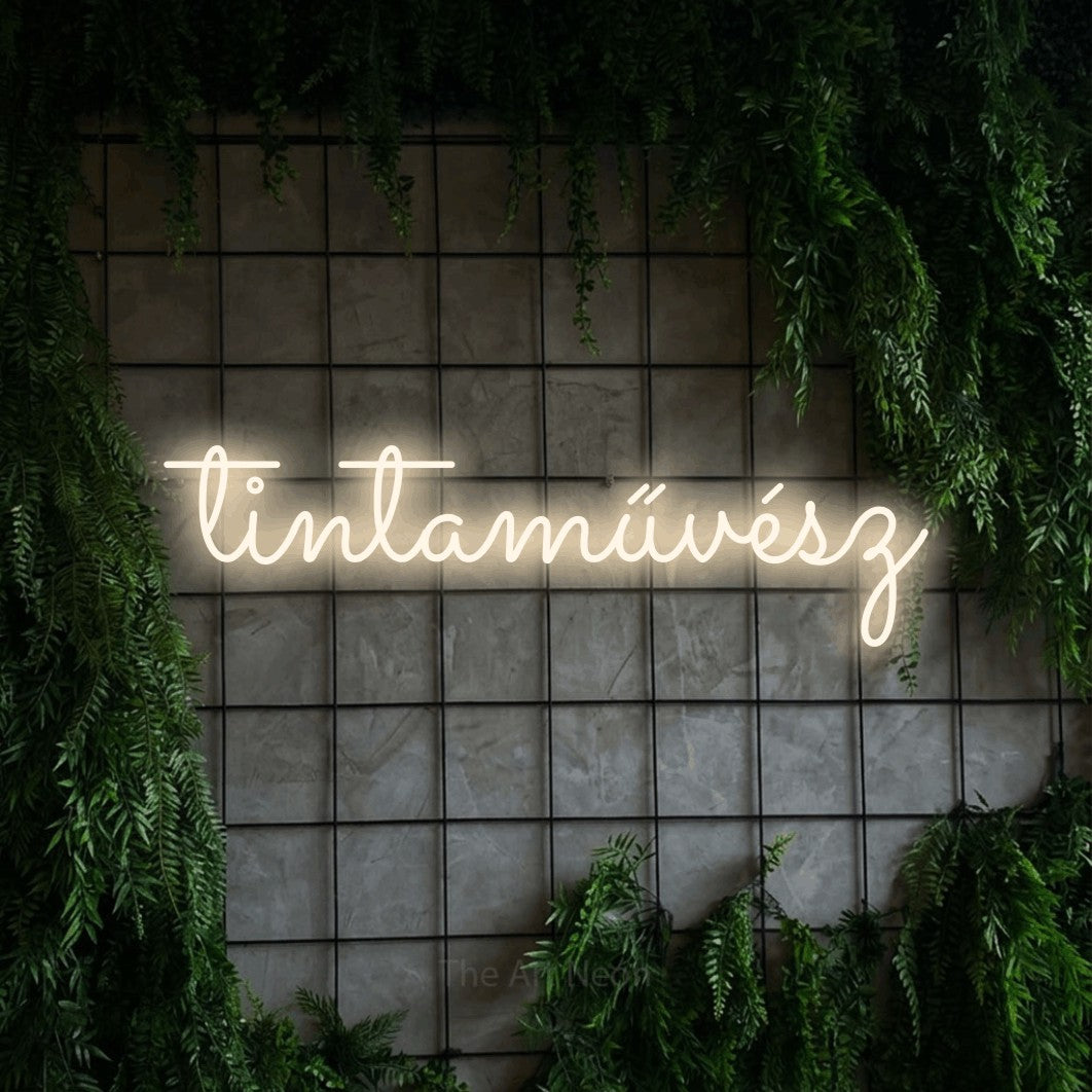 LED neon sign reading “tintaművész”, arranged in a single line.