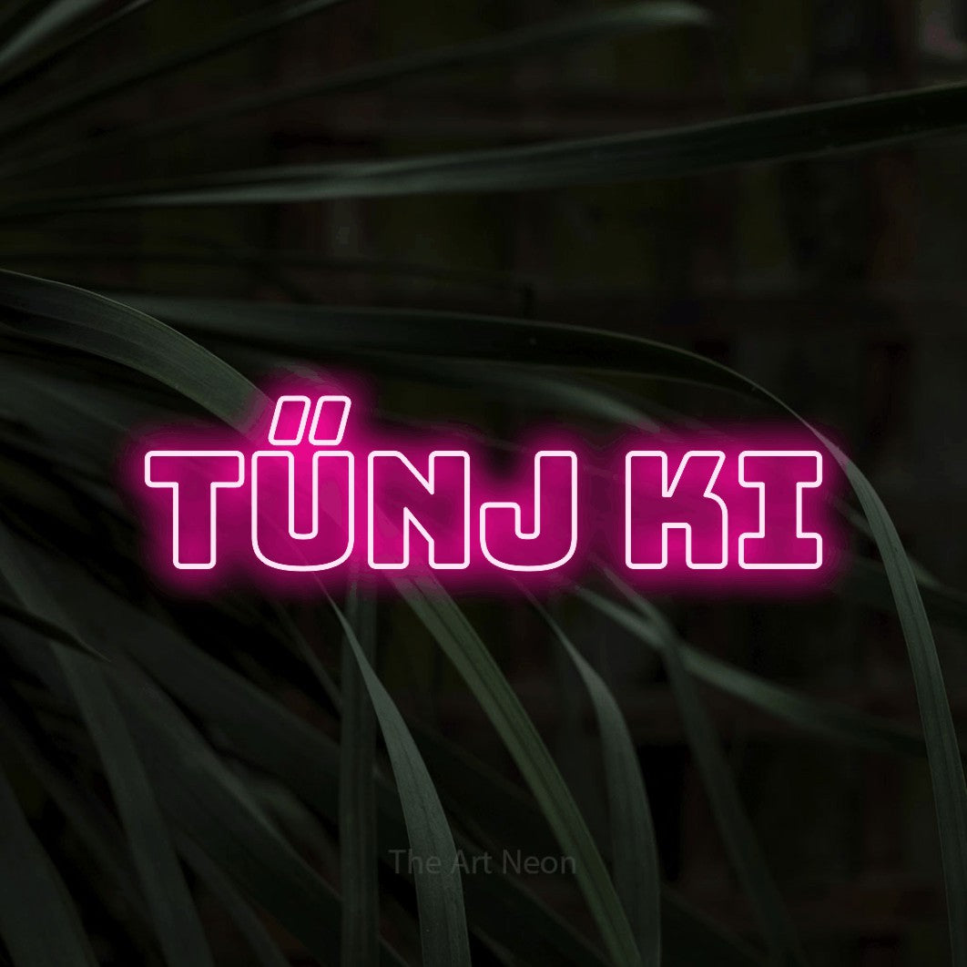 LED neon sign reading “Tűnj Ki”, arranged in a single line.
