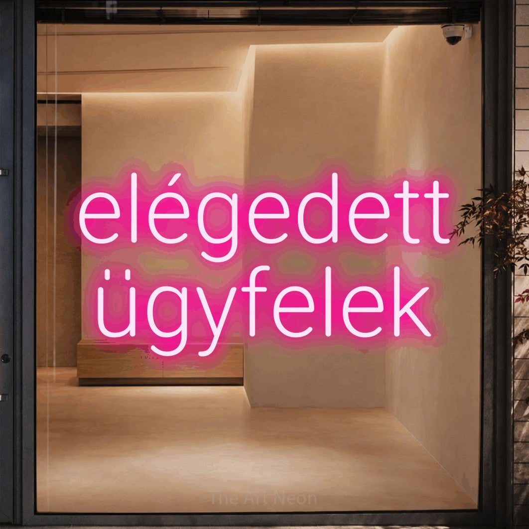 LED neon sign reading “elégedett ügyfelek”, arranged in two lines.