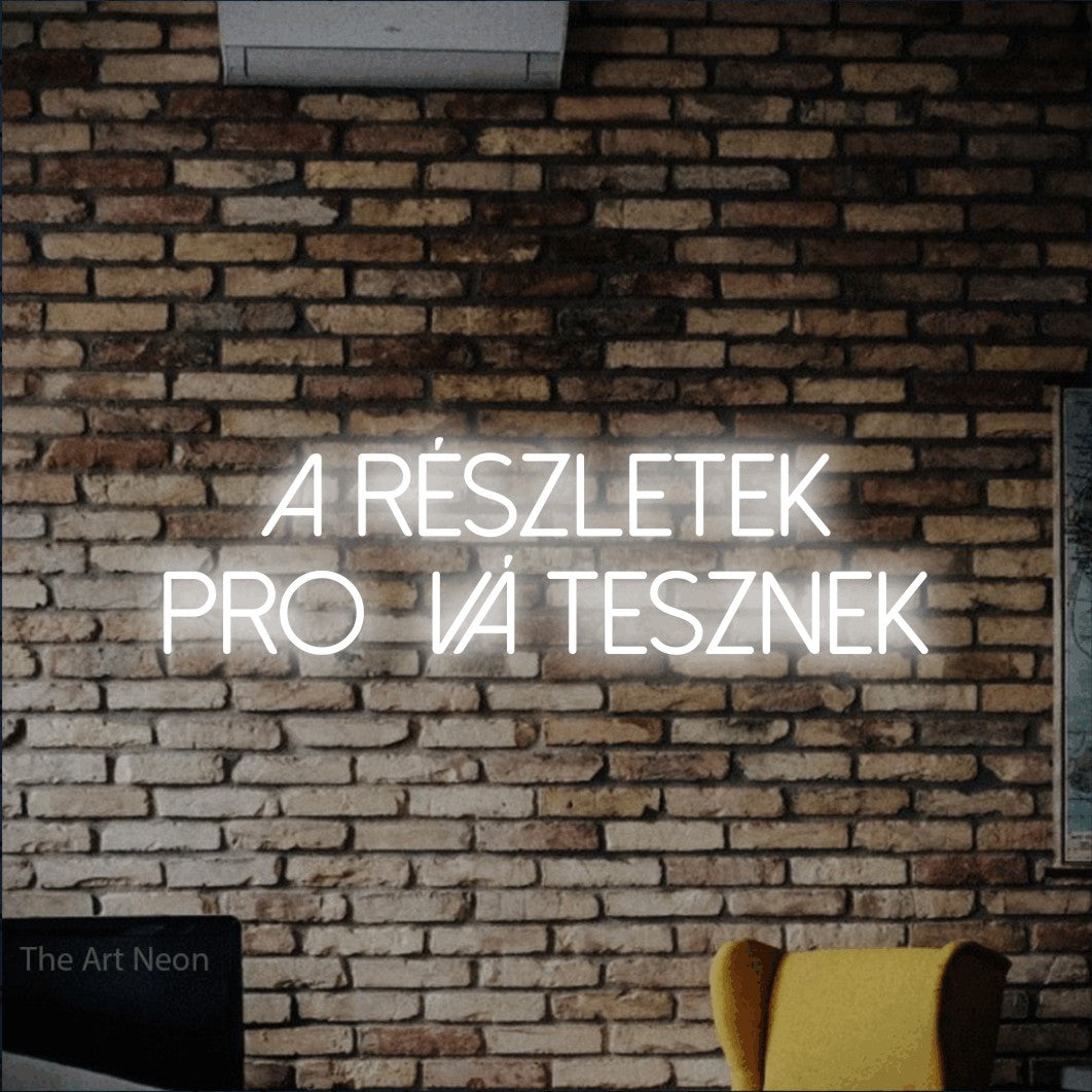 LED neon sign reading “a részletek profivá tesznek”, arranged in two lines.