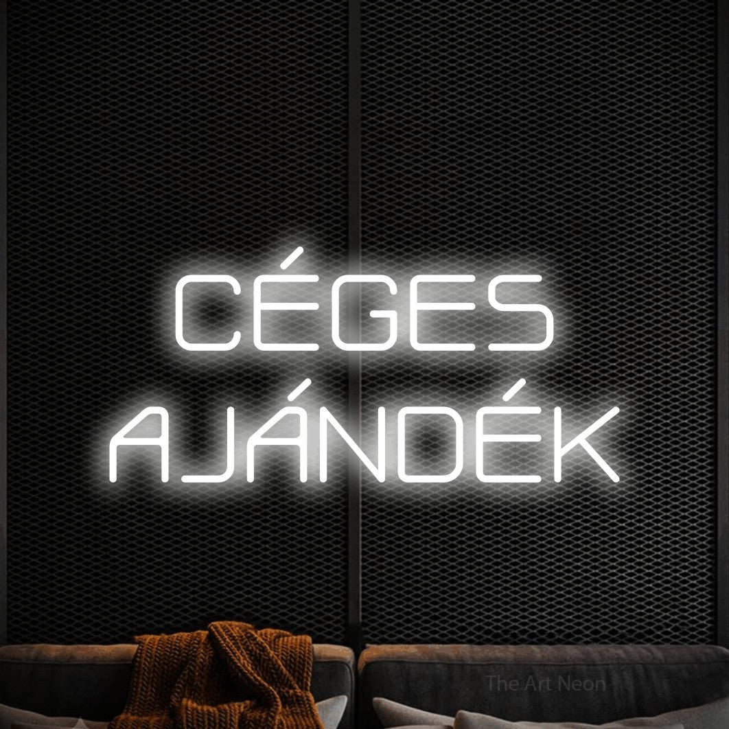 LED neon sign reading “CÉGES AJÁNDÉK”, arranged in two lines.
