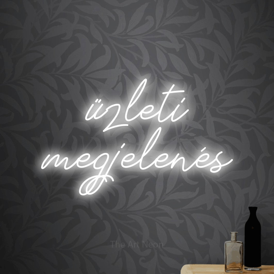 LED neon sign reading “üzleti megjelenés”, arranged in two lines.
