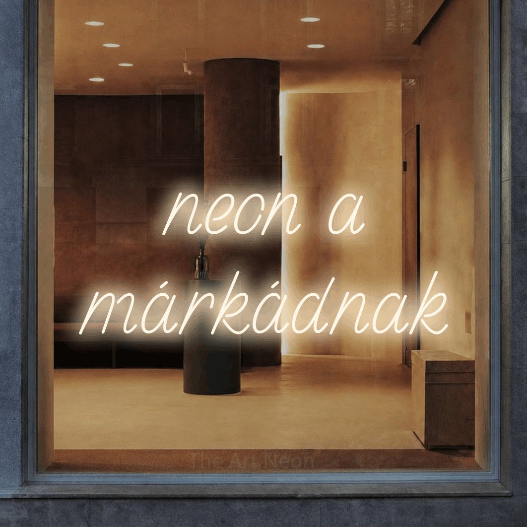 LED neon sign reading “neon a márkádnak”, arranged in two lines.