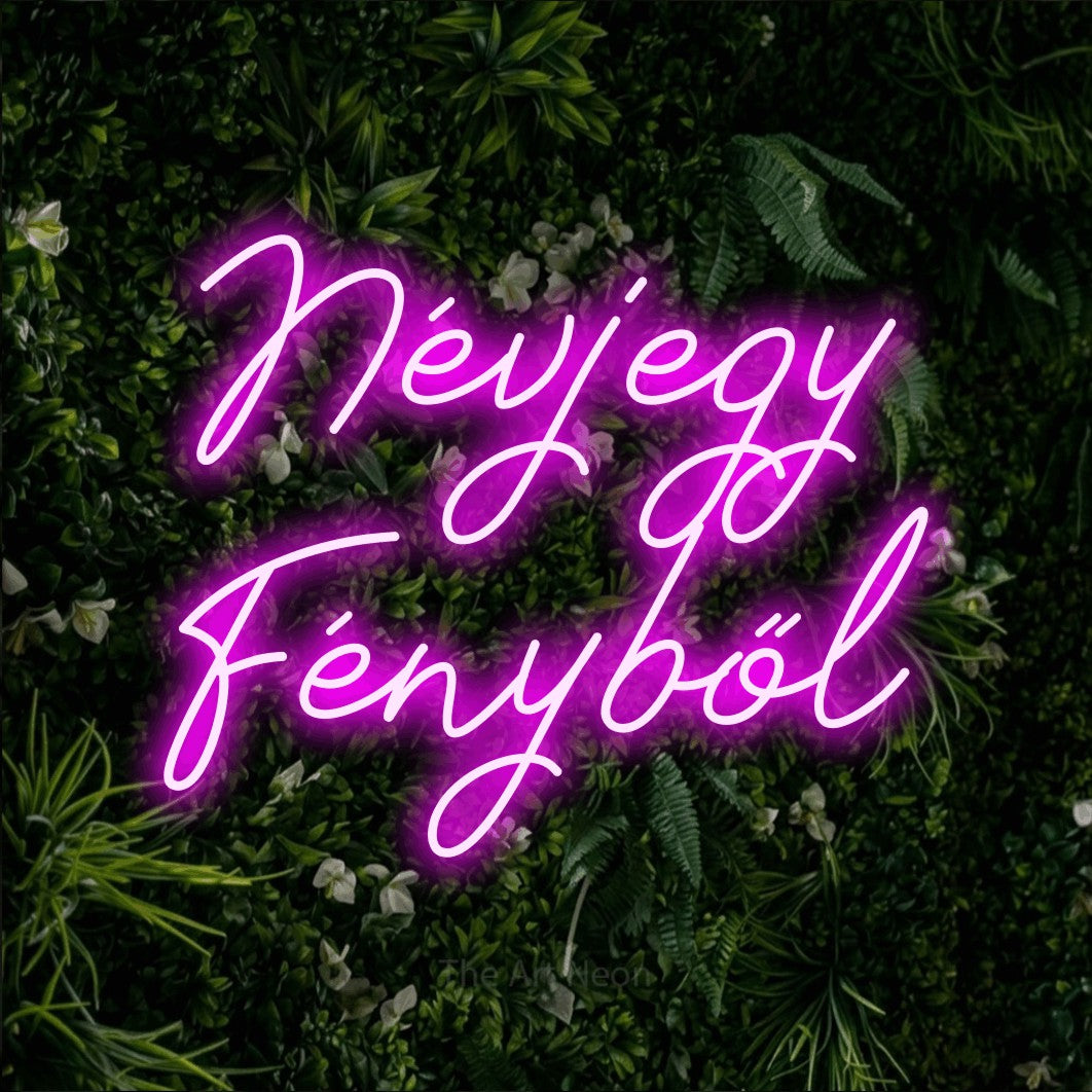 LED neon sign reading “Névjegy Fényből”, arranged in two lines.