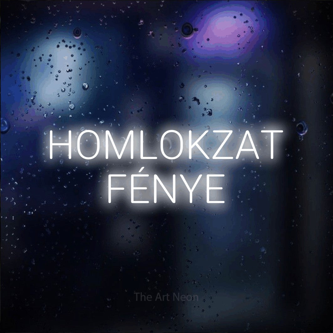 LED neon sign reading “HOMLOKZAT FÉNYE”, arranged in two lines.