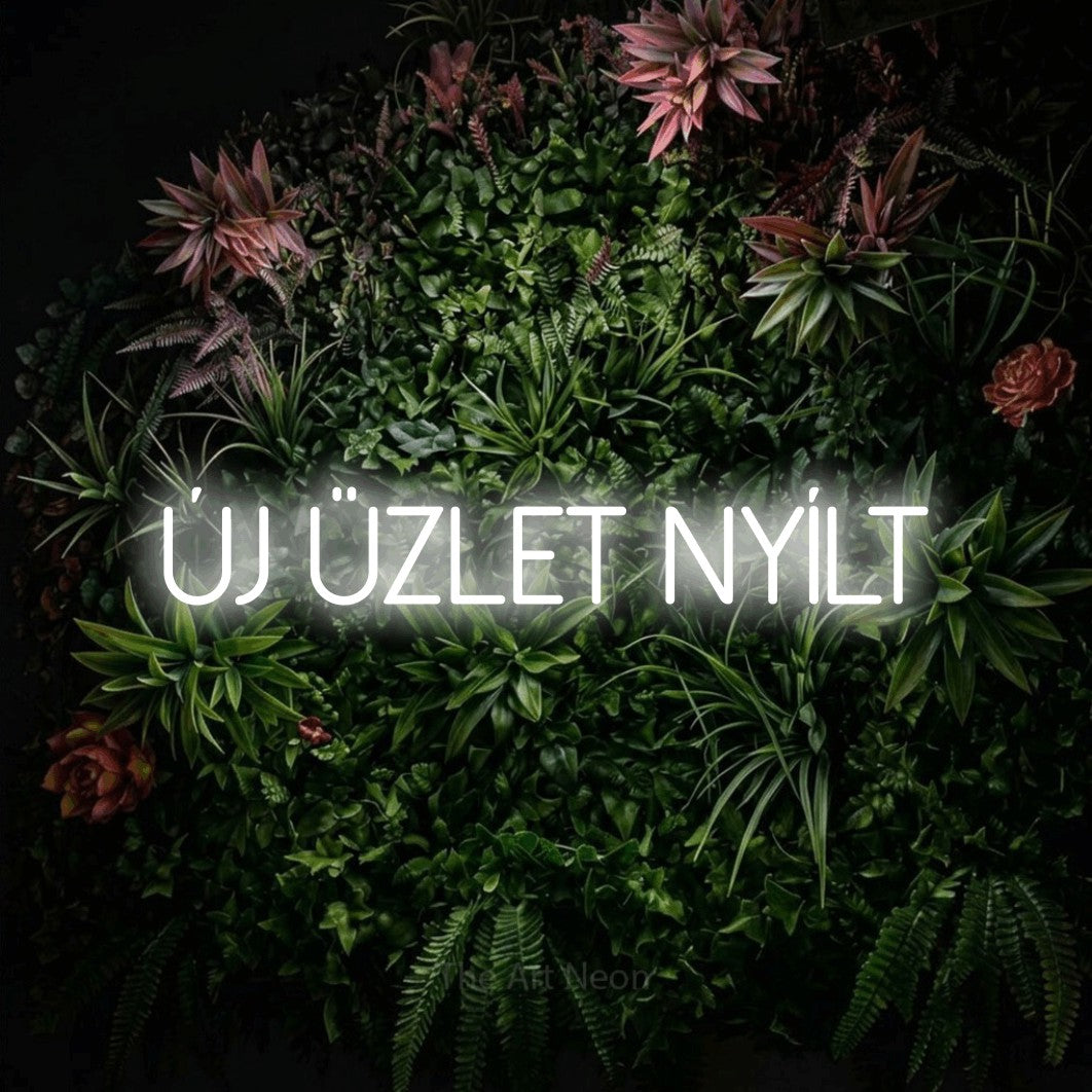 LED neon sign reading “Új Üzlet Nyílt”, arranged in a single line.