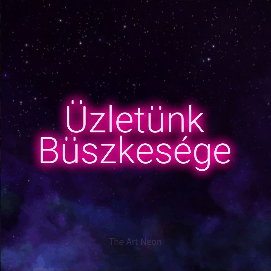 LED neon sign reading “Üzletünk Büszkesége”, arranged in two lines.