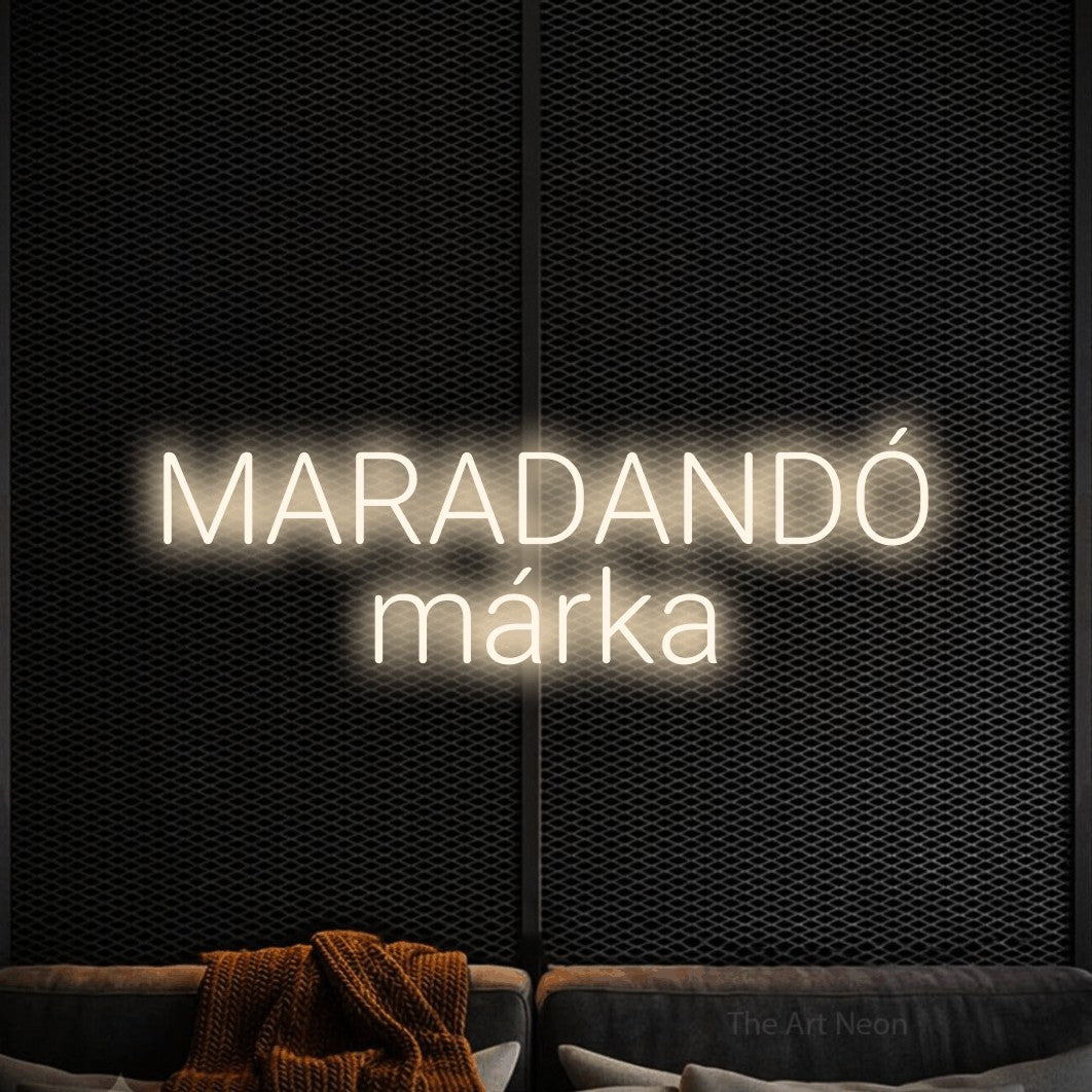 LED neon sign reading “MARADANDÓ márka”, arranged in two lines.