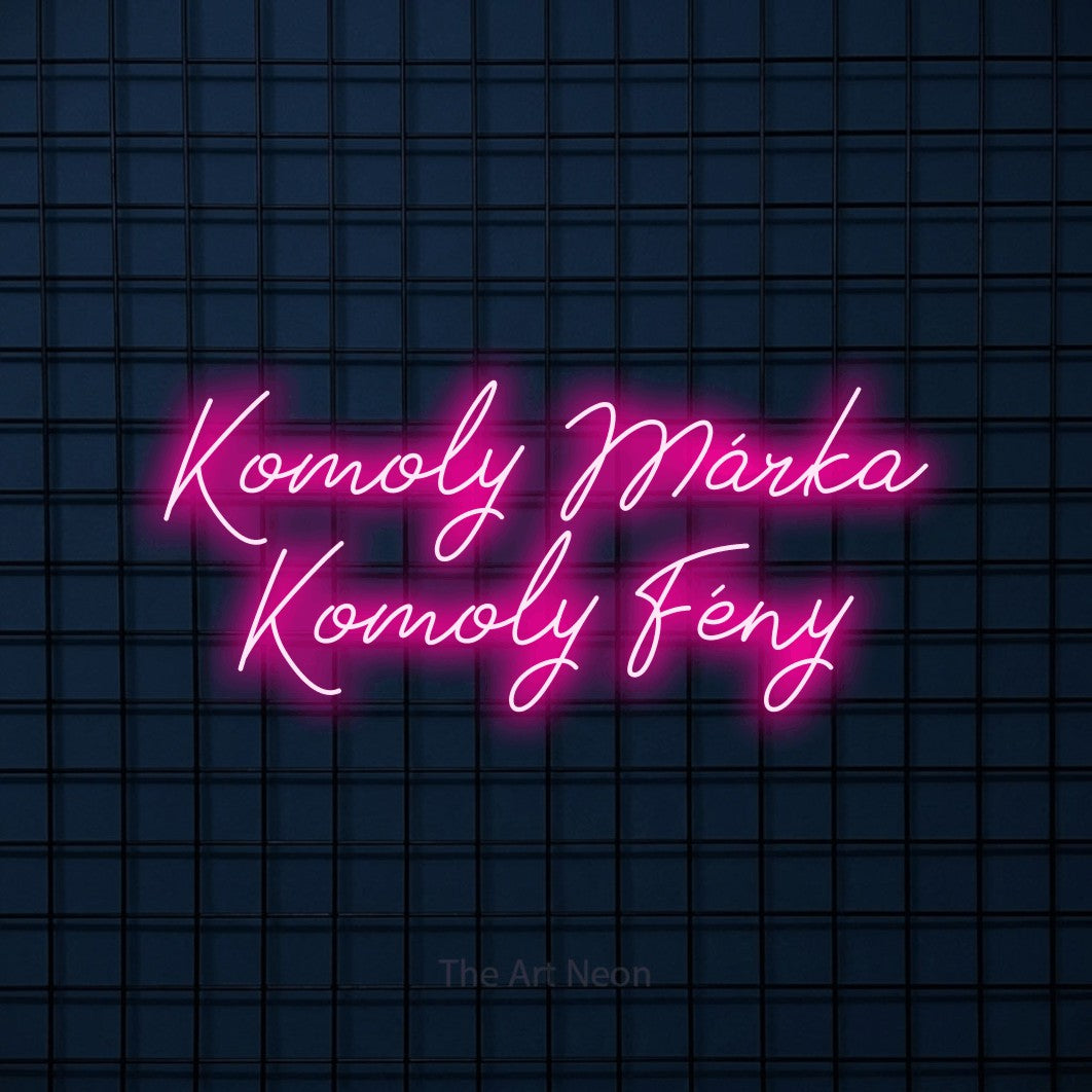 LED neon sign reading “Komoly Márka Komoly Fény”, arranged in two lines.