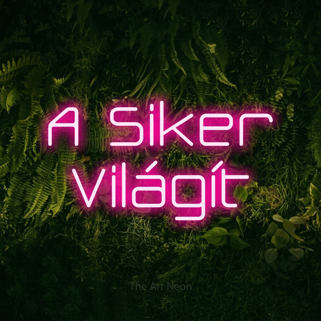 LED neon sign reading “A Siker Világít”, arranged in two lines.