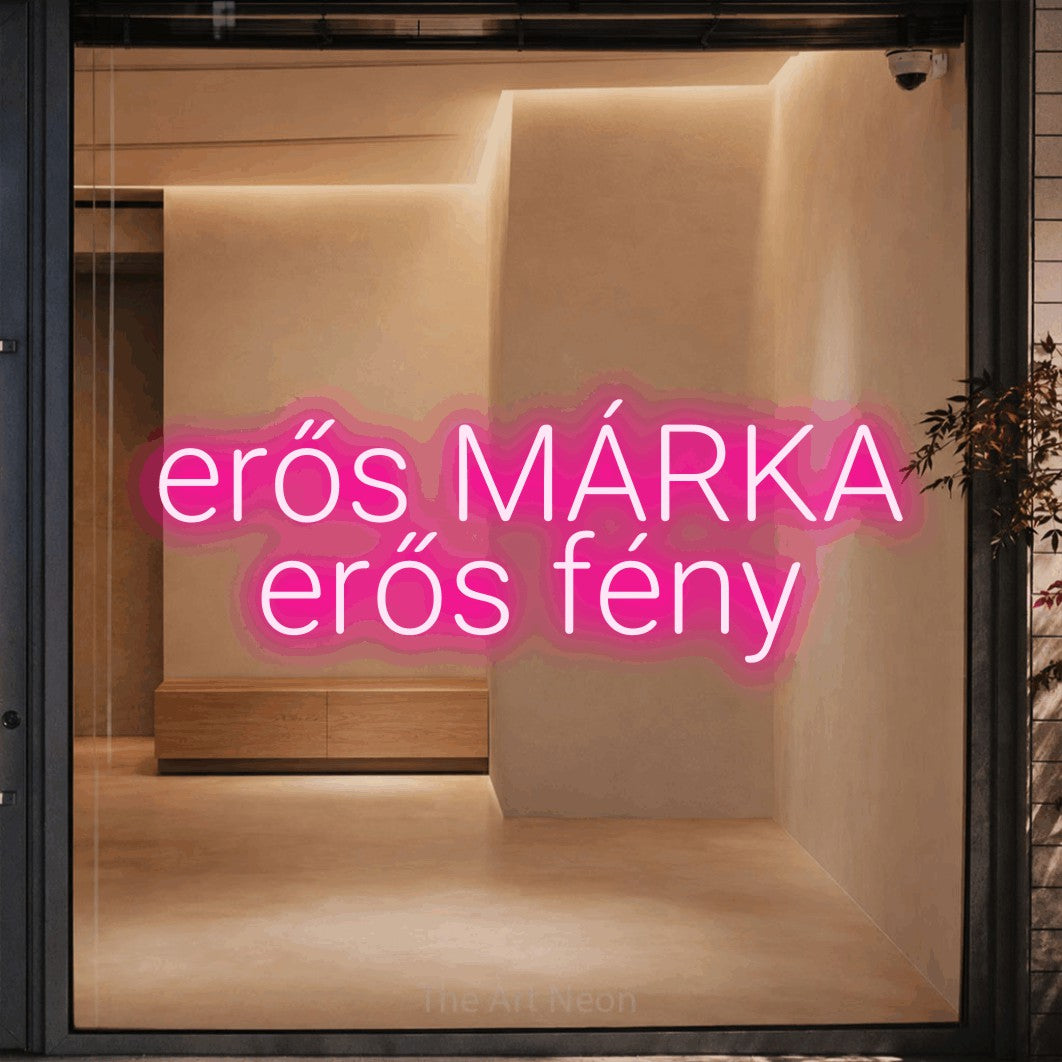 LED neon sign reading “erős MÁRKA erős fény”, arranged in two lines.