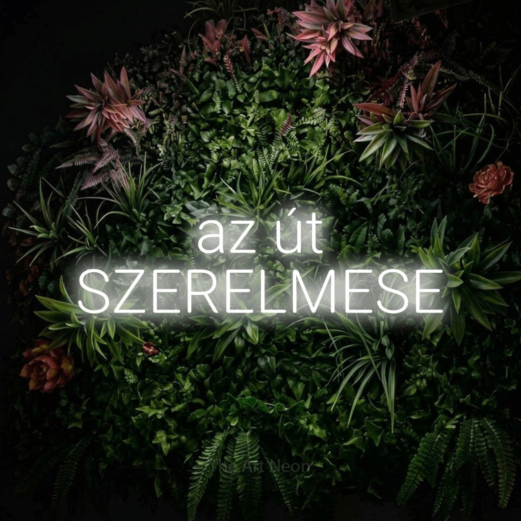 LED neon sign reading “az út SZERELMESE”, arranged in two lines.