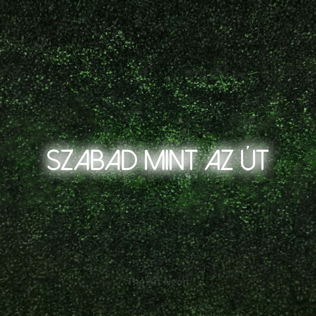 LED neon sign reading “szabad mint az út”, arranged in a single line.