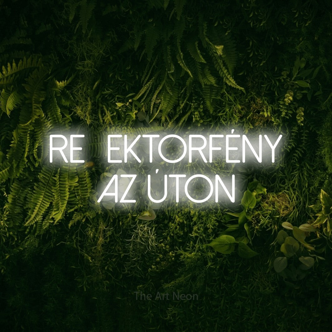 LED neon sign reading “Reflektorfény Az Úton”, arranged in two lines.