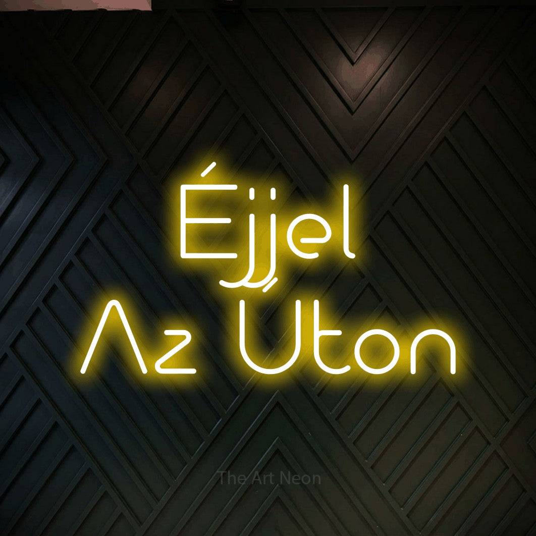LED neon sign reading “Éjjel Az Úton”, arranged in two lines.