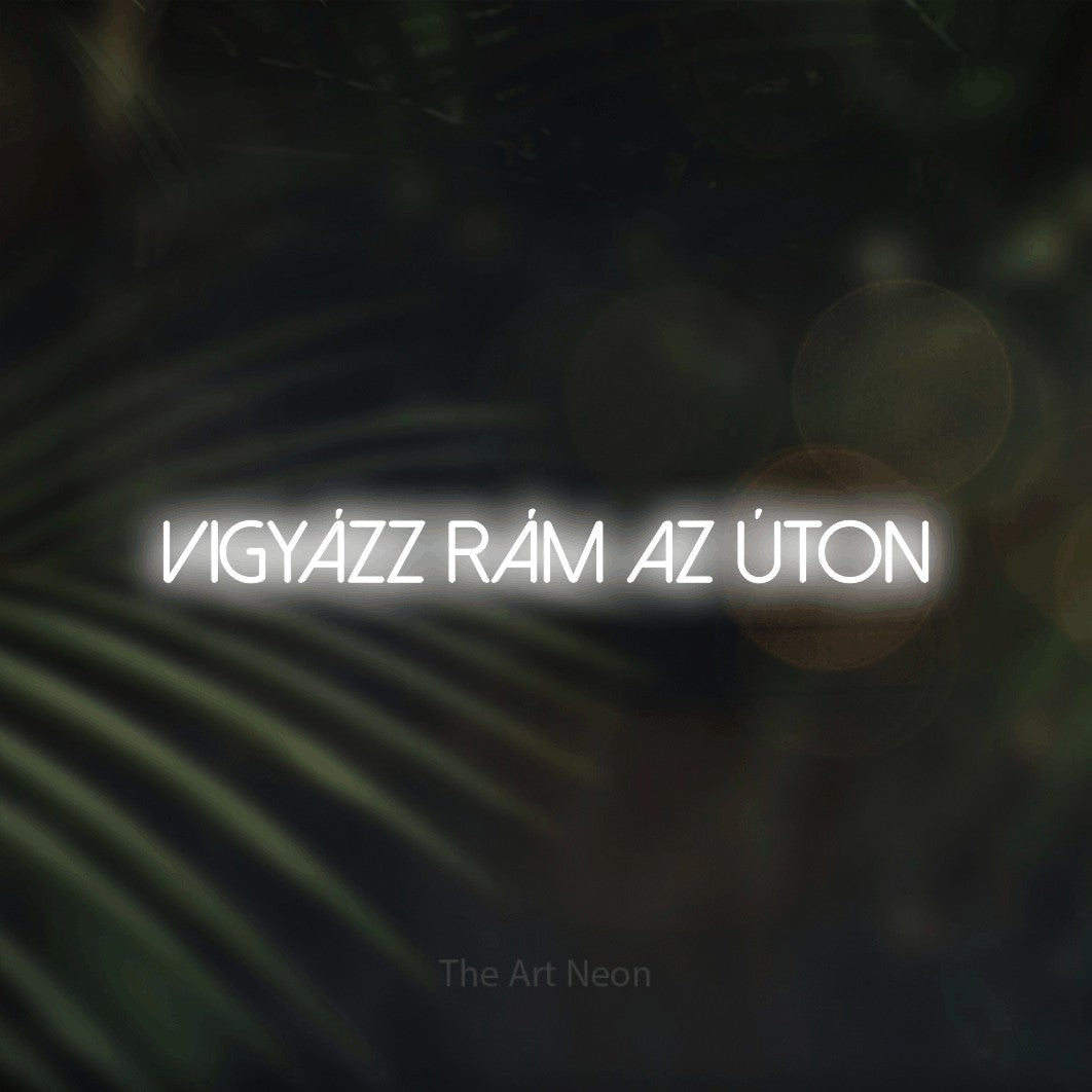 LED neon sign reading “Vigyázz Rám Az Úton”, arranged in a single line.