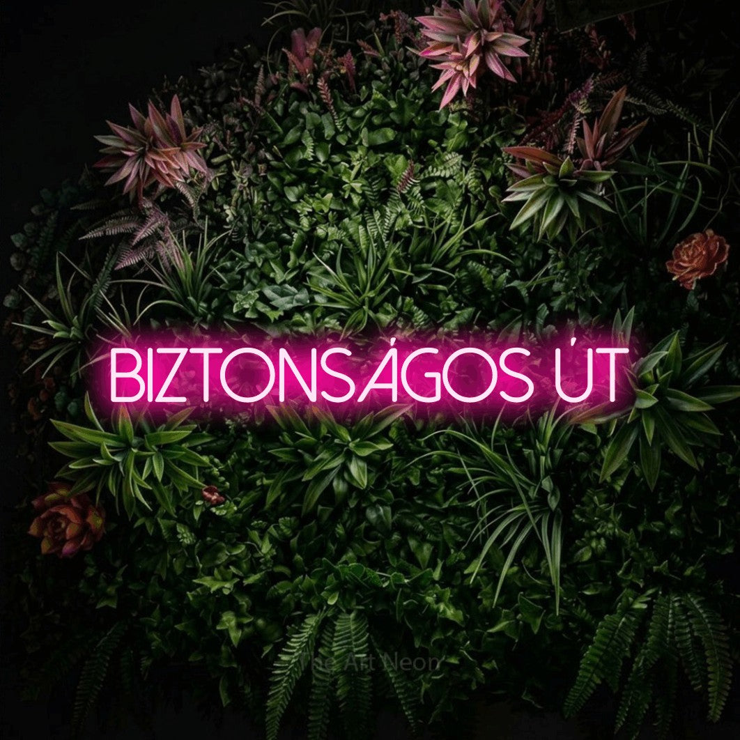 LED neon sign reading “Biztonságos Út”, arranged in a single line.