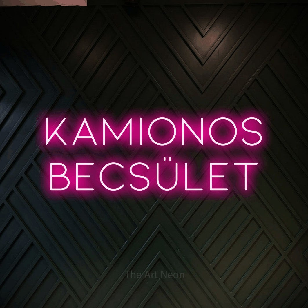 LED neon sign reading “kamionos becsület”, arranged in two lines.