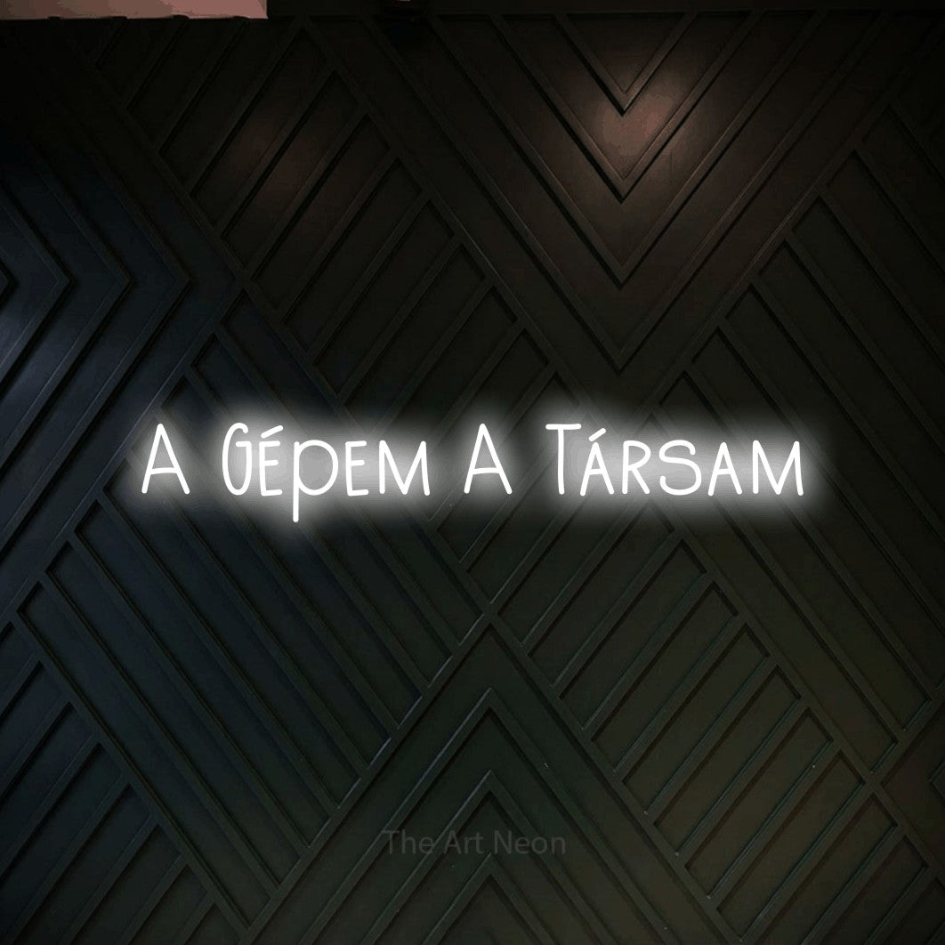 LED neon sign reading “A Gépem A Társam”, arranged in a single line.