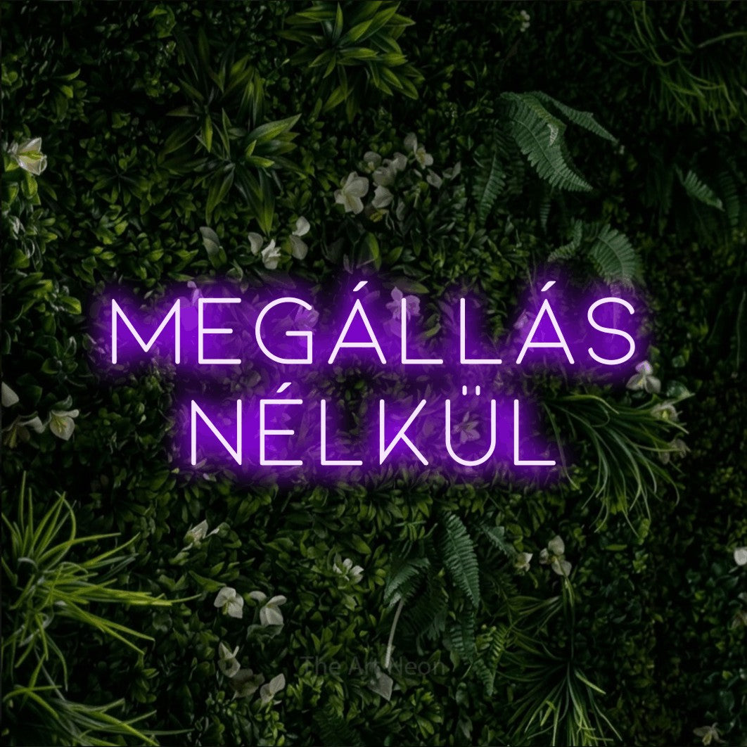 LED neon sign reading “MEGÁLLÁS NÉLKÜL”, arranged in two lines.