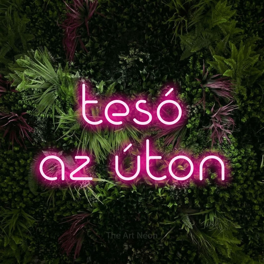 LED neon sign reading “tesó az úton”, arranged in two lines.