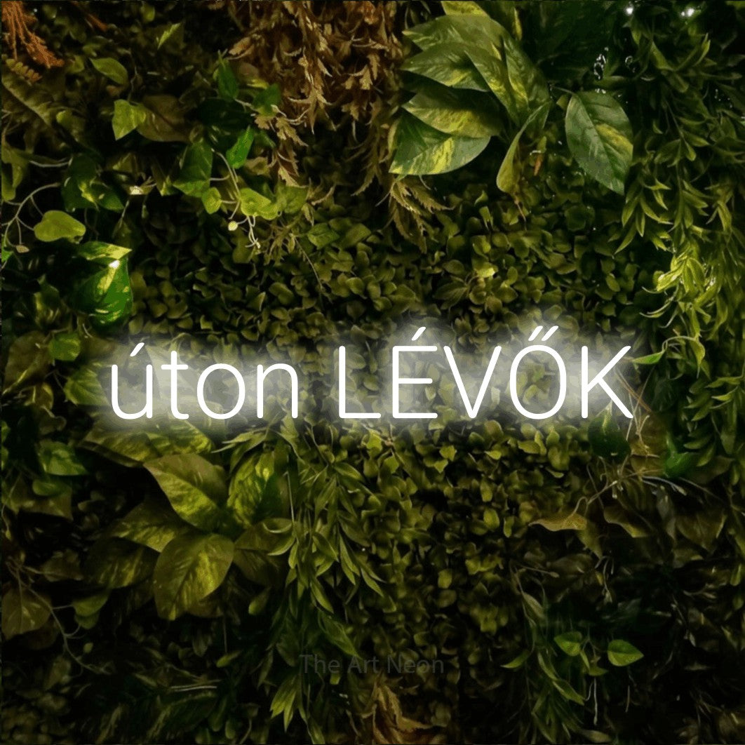 LED neon sign reading “úton LÉVŐK”, arranged in a single line.