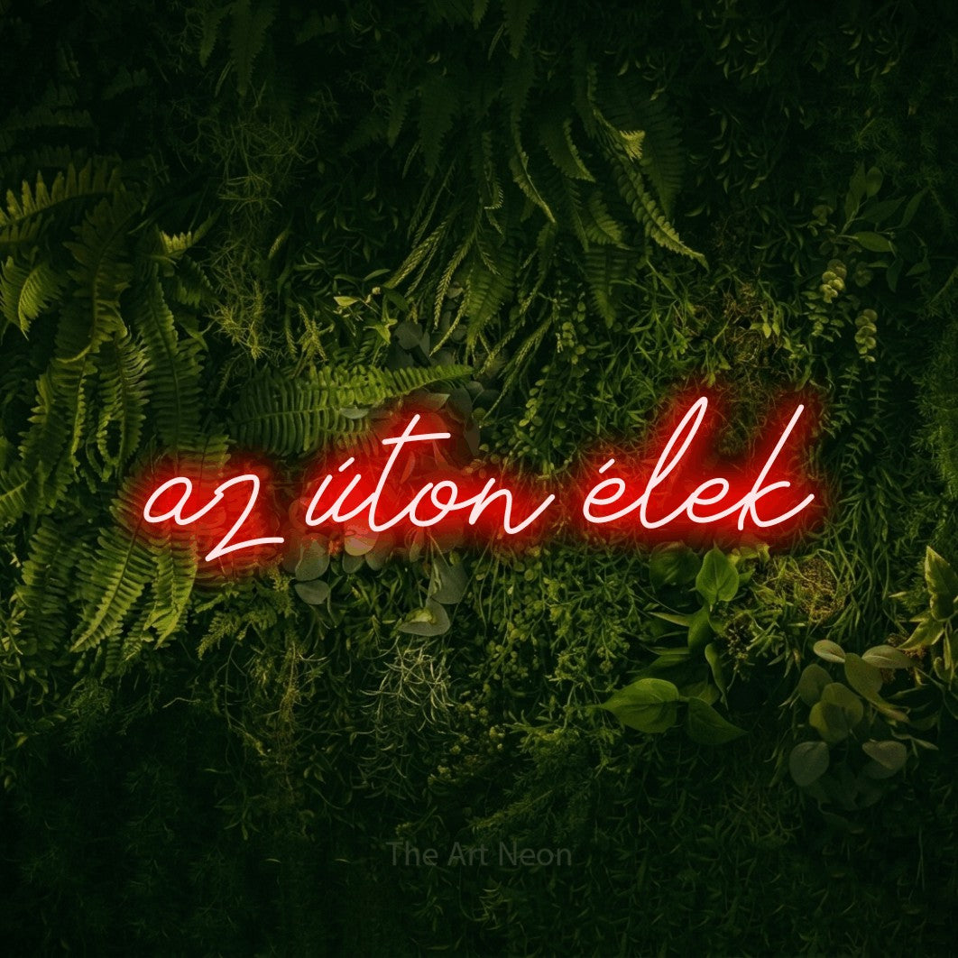 LED neon sign reading “az úton élek”, arranged in a single line.