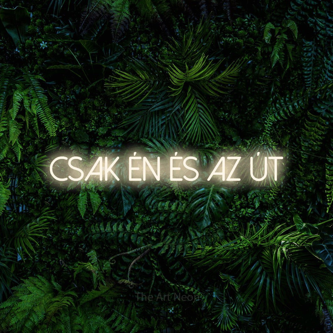 LED neon sign reading “CSAK ÉN ÉS AZ ÚT”, arranged in a single line.