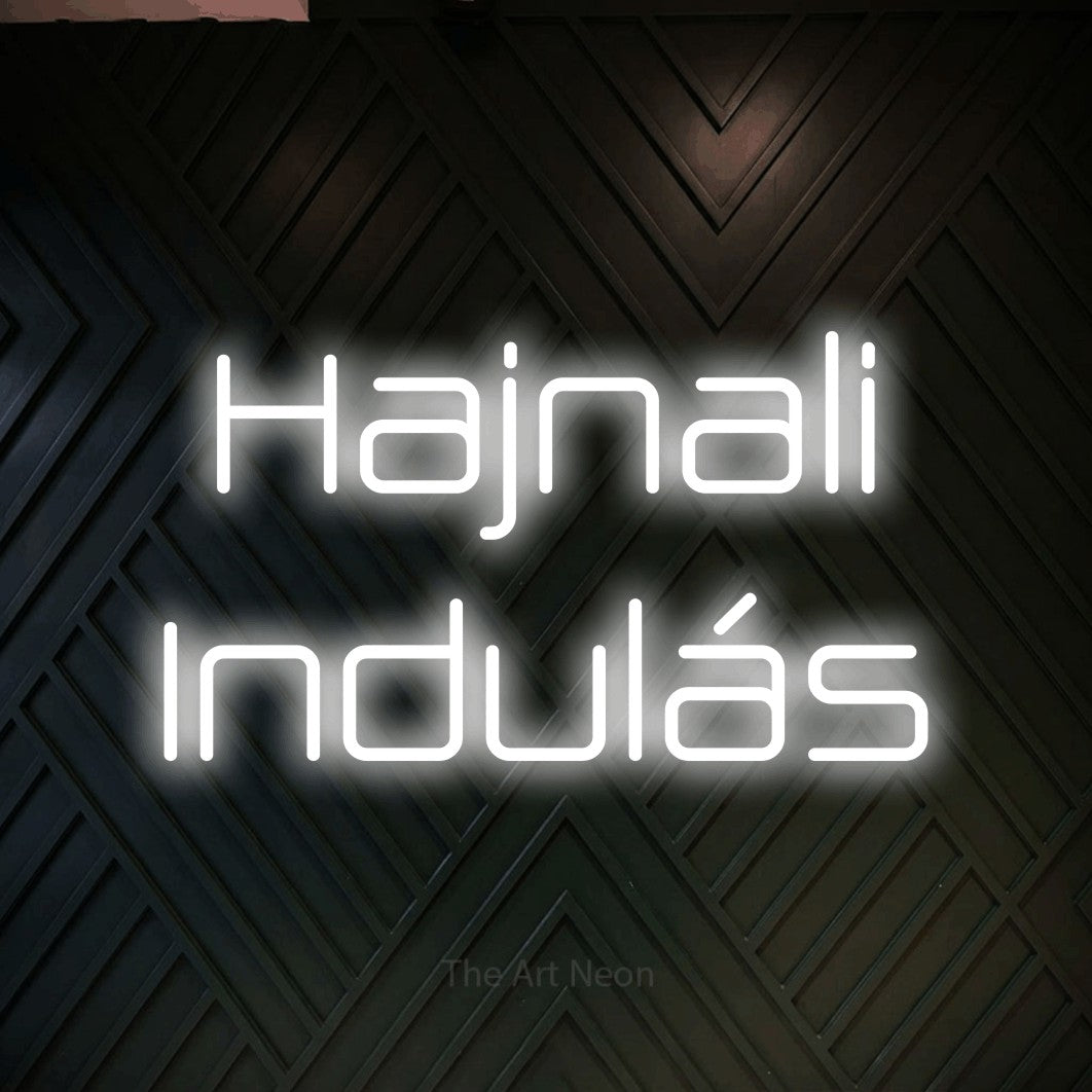 LED neon sign reading “Hajnali Indulás”, arranged in two lines.