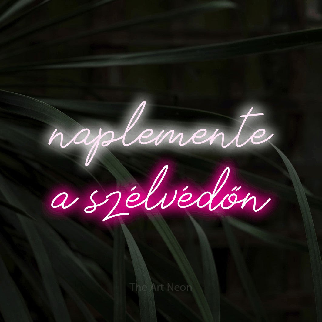 LED neon sign reading “naplemente a szélvédőn”, arranged in two lines.