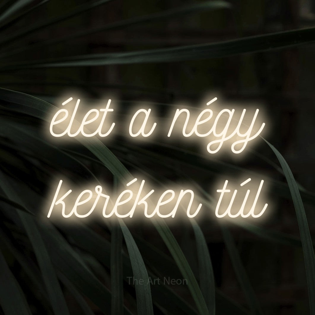 LED neon sign reading “élet a négy keréken túl”, arranged in two lines.