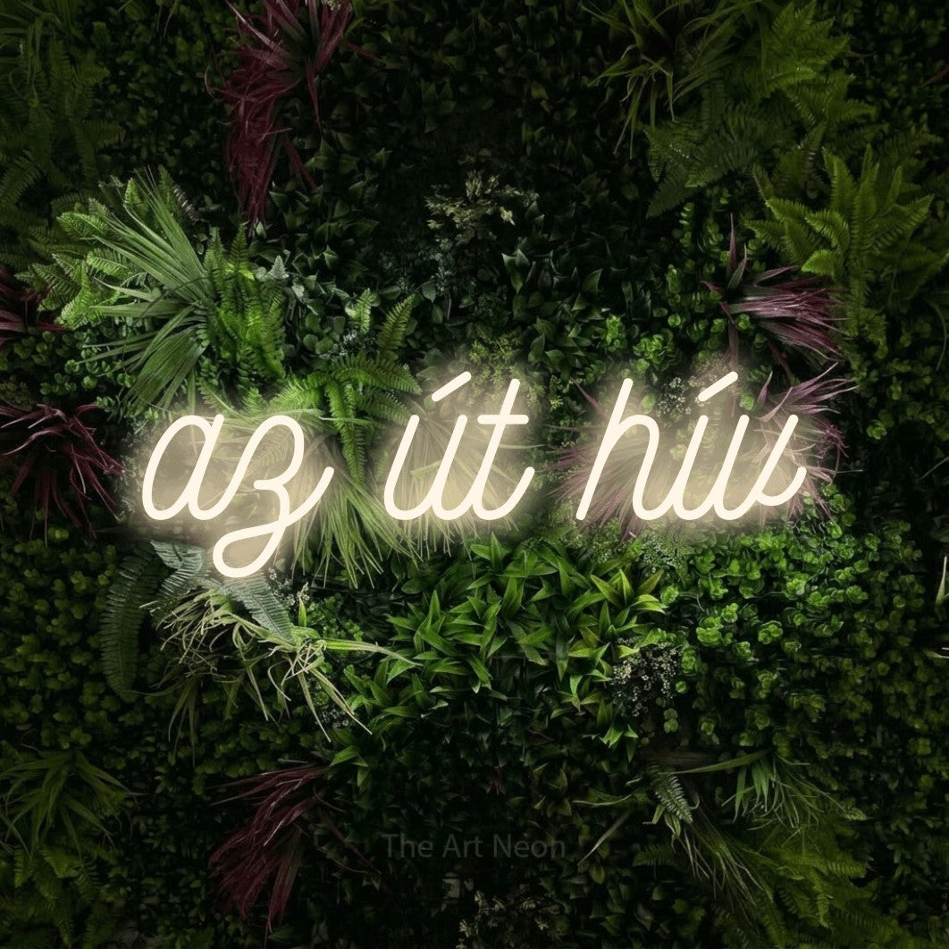 LED neon sign reading “az út hív”, arranged in a single line.