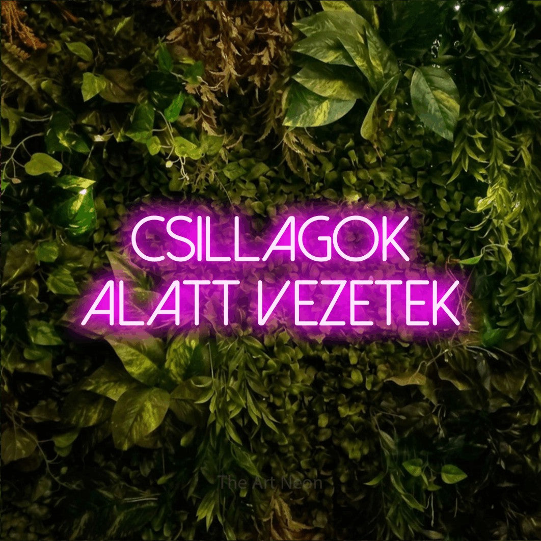 LED neon sign reading “Csillagok Alatt Vezetek”, arranged in two lines.