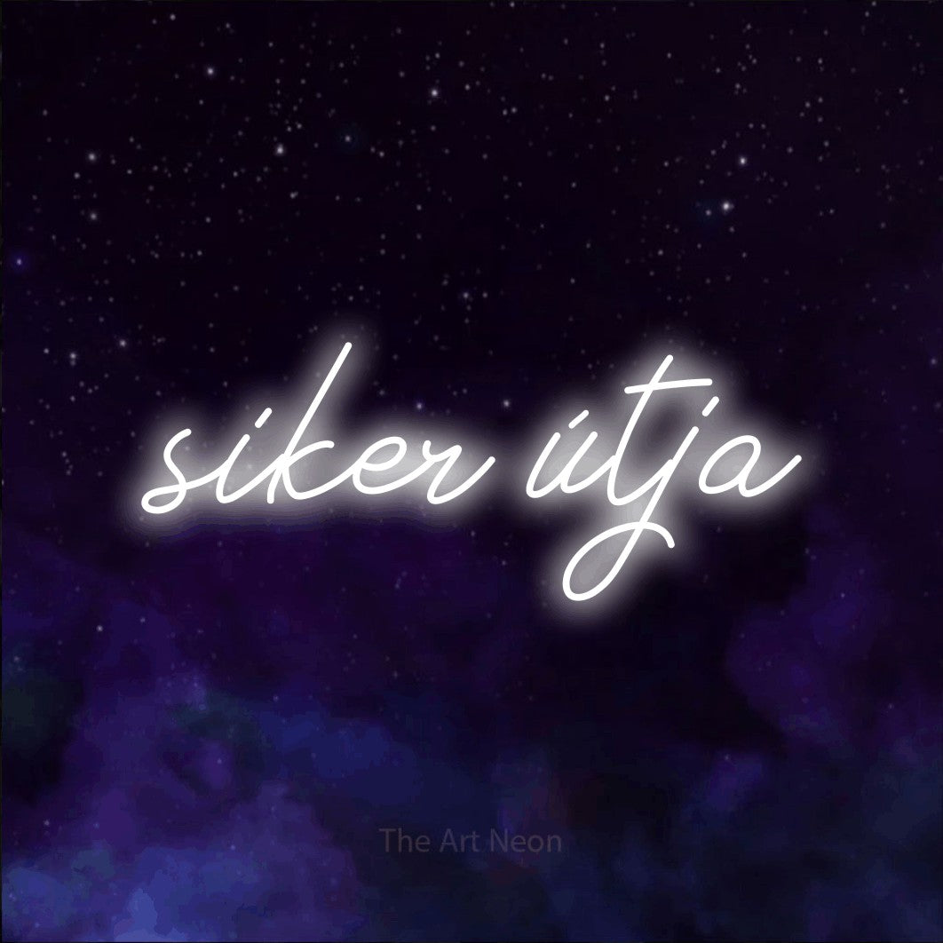 LED neon sign reading “siker útja”, arranged in a single line.